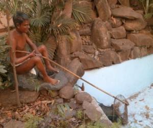 Figure of a tribal fisherman at the Tribal Cultural Museum in Pune