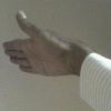 An arm extended to shake hands