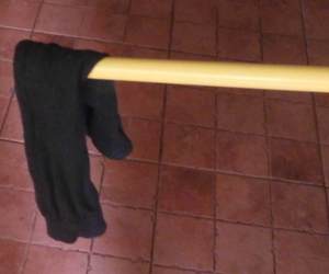 A sock dangling at the end of a stick