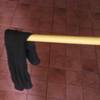 A sock dangling at the end of a stick